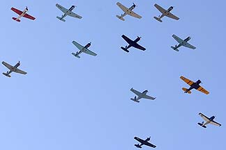 Twelve Nanchang CJ-6s, two Beech T-34 Mentors, a North Americn SNJ Texan, and a Yak-52, Cactus Fly-in, March 3, 2012